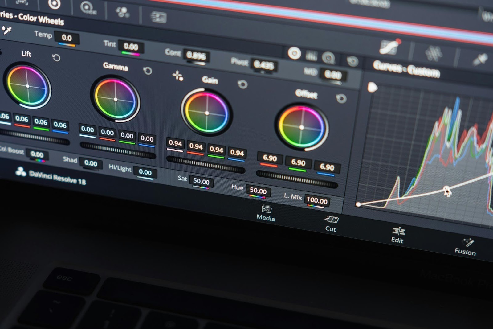 Interface of video editing software showing color wheels, highlighting the role of high-quality video content in modern strategies.